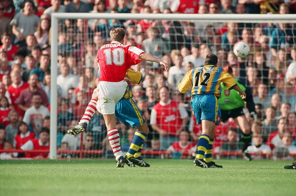 Dennis Bergkamp scores his second goal for his new club Arsenal