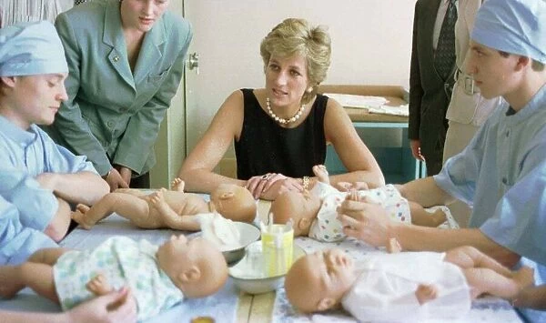 Diana, Princess of Wales, pictured with nurses in the baby care unit at the Tushinskaya