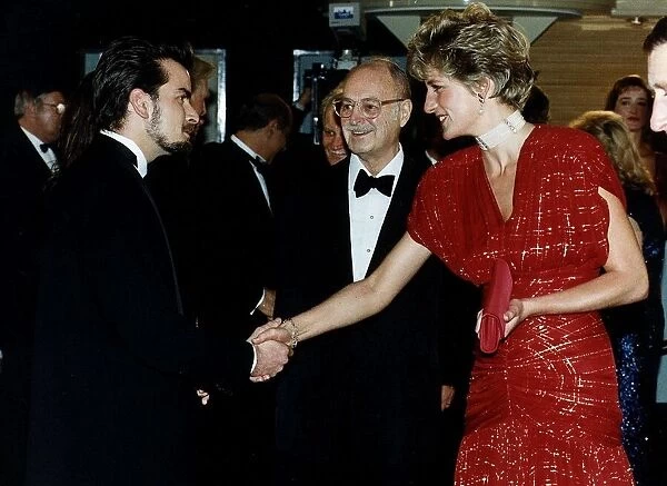 Diana, Princess of Wales talks to American actor Charlie Sheen as she attends