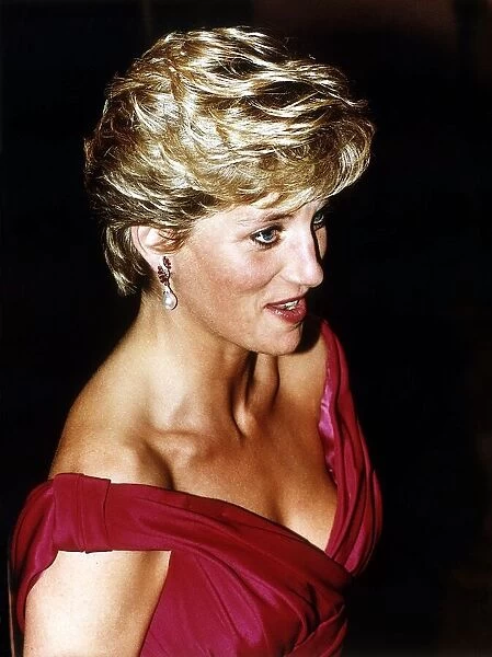 Diana, Princess of Wales, wearing a Victor Edelstein evening dress to a performance of