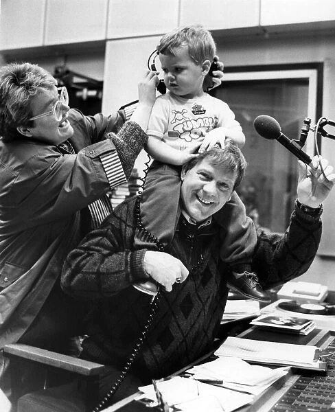 'Disc jockey', two year old Paul Clark of Formby takes a ride with Radio