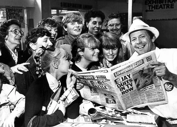 DJ Billy Butler shows off the new style of tabloid Liverpool Echo to visitors to the Echo