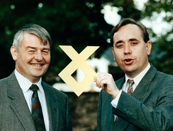 Doctor W. Allan Macartney and Alex Salmond with the SNP logo. 18th September 1991
