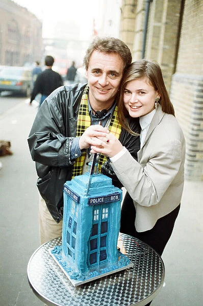 Dr Who, Sylvester McCoy with his assistant Ace alias Sophie Aldred cutting a cake in