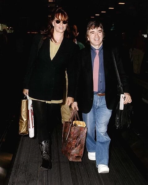 Dudley Moore Actor Comedian With His Wife Actress Brogan Lane At London Airport