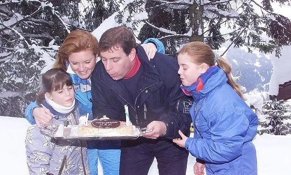 The Duke of York blows out birthday candles February on the chocolate cake given to