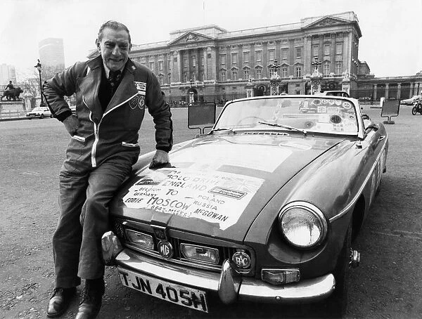 Eddie McGowan & his MGB outside Buckingham Palace, which they will be visiting