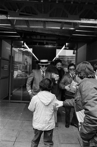 Elton John leaving the TV-am studios. 4th April 1983