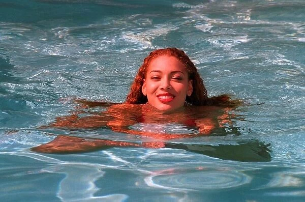 Emma Komlosy daughter of Actress Patti Boulaye at home in swimming pool