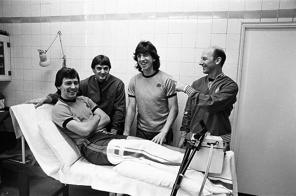 England player sat the treatment table - skipper Bryan Robson gets the attention of Fred
