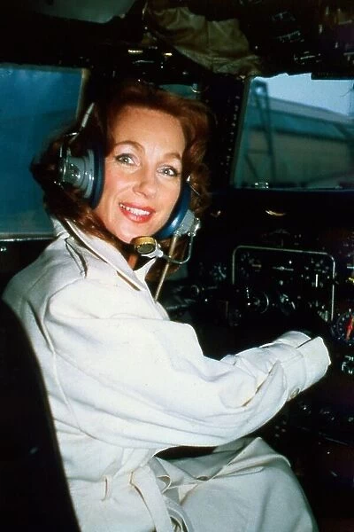 English actress Shirley Anne Field in the cockpit of a helicopter. June 1980