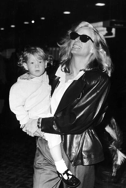 Farrah Fawcett Actress with her son Redmond leave for Los Angeles May 1987