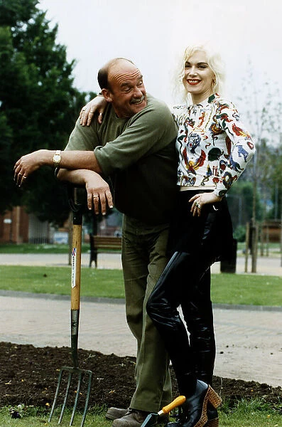 Fashion designer Pam Hogg standing with her arm around gardener Willie Hall who is