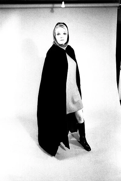 A fashion shoot from 13 April 1970 - A model wears a cloak and knee lenght boots
