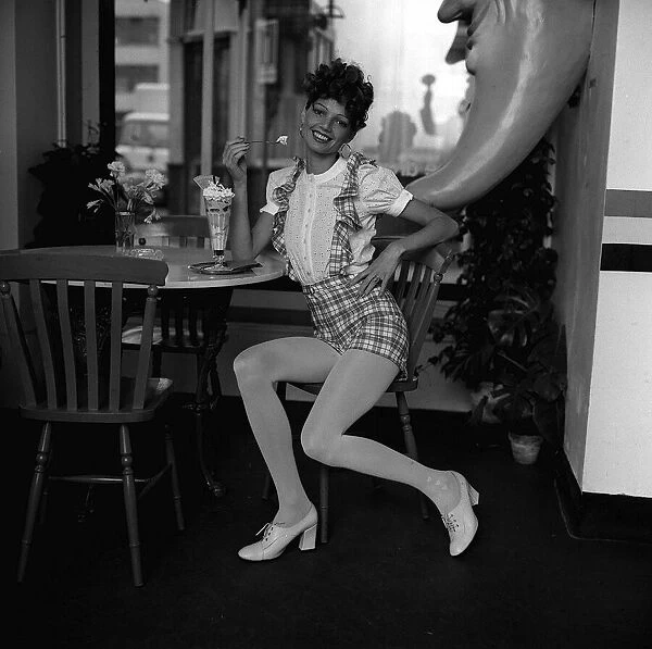 Fashion Shorts Seventies 1971 Model wearing short dungarees with tartan check