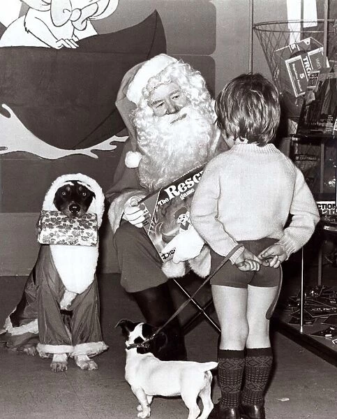 Father Christmas Santas Claus in his Grotto - December 1977 a little boy with his