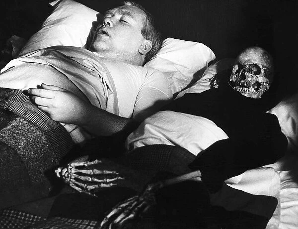Films Under Milk Wood starring in a scene is actor Ray Smith with his skeleton wife in