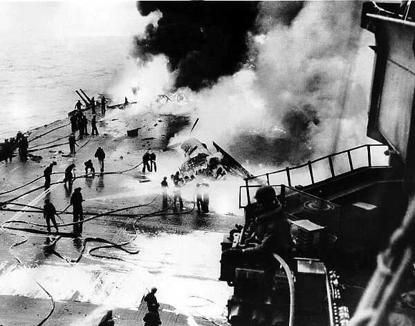 Fire crews battle to put out fire on the aircraft carrier US Saratoga after being hit