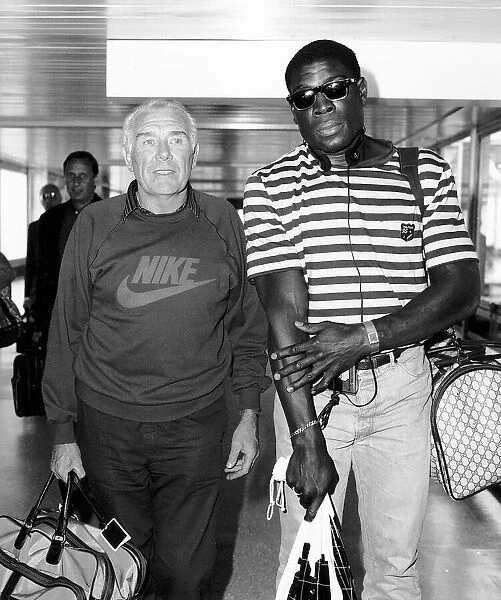 Frank Bruno Boxing arrives at Heathrow with manager