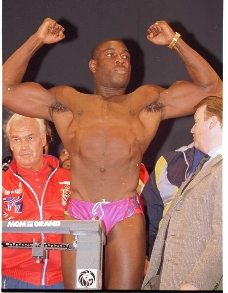 Frank Bruno flexes his muscles at the weigh in. Ready for the fight against Mike Tyson in