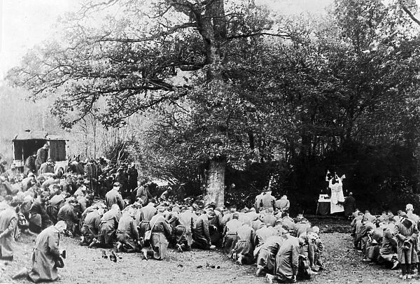 French soldiers hold a mass for their fallen comrades just behind the front line near