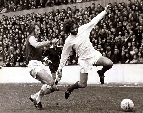 George Best Football Player - April 1971 is tackled by Billy Bond of West Ham