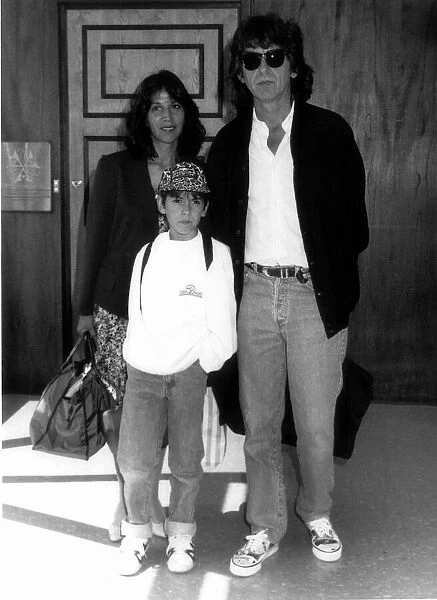George Harrison formerly of the Beatles with family at London Airport August 1989