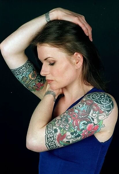 Girl with coloured tattoos on her arms. April 1996