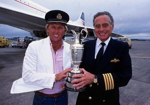Greg Norman holds the Claret Jug trophy after winning the British Open with Concorde