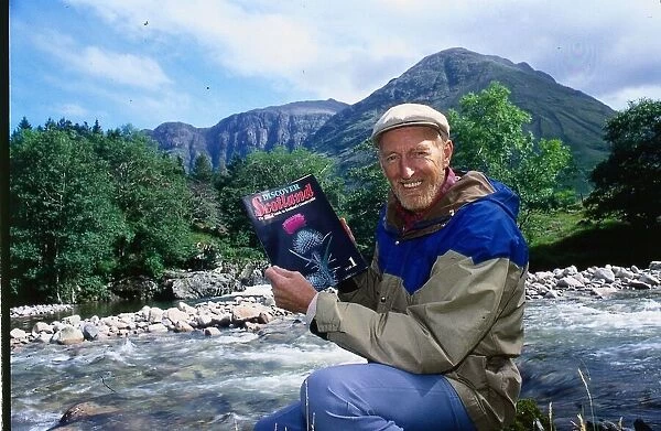 Hamish McInnes author 3rd September 1989 Scots author holding copy of The Sunday