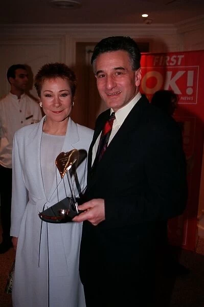 Henry Goodman Actor pictured with Zoe Wanamaker holding best Stage Actor award of 1998