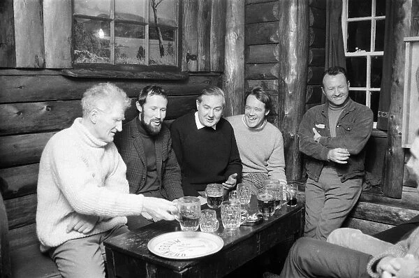 Home Secretary James Callaghan having a drink with the some members of a climbing team