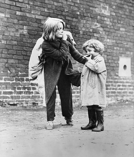 Hull - 19th July 1941. Two little girls pictured leaving the city of Hull