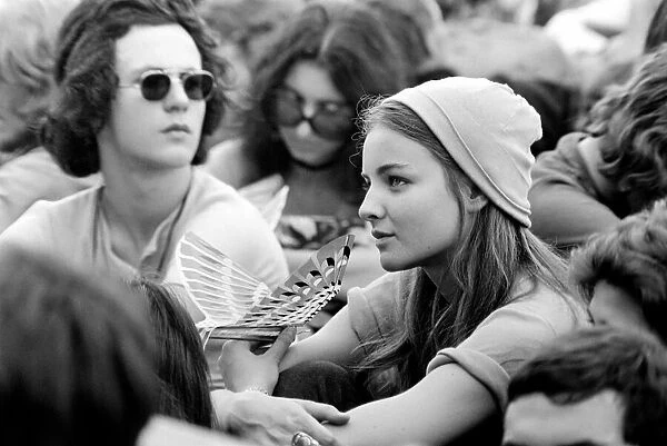 Hyde Park Pop Festival. A very pretty girl spotted in the crowd with a bird-like toy that