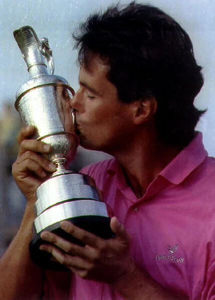 Ian Baker Finch Australian Golfer holding and kissing golf trophy