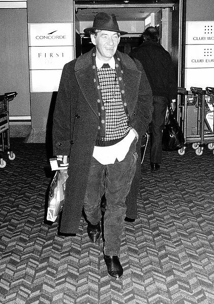 Ian McKellen actor leaving Heathrow Airport for New York