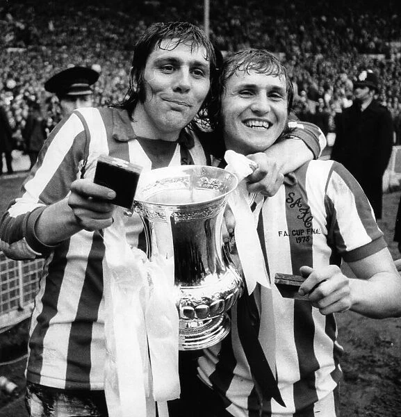 Ian Porterfield (left) and Dennis Tueart of Sunderland celebrate after winning FA Cup