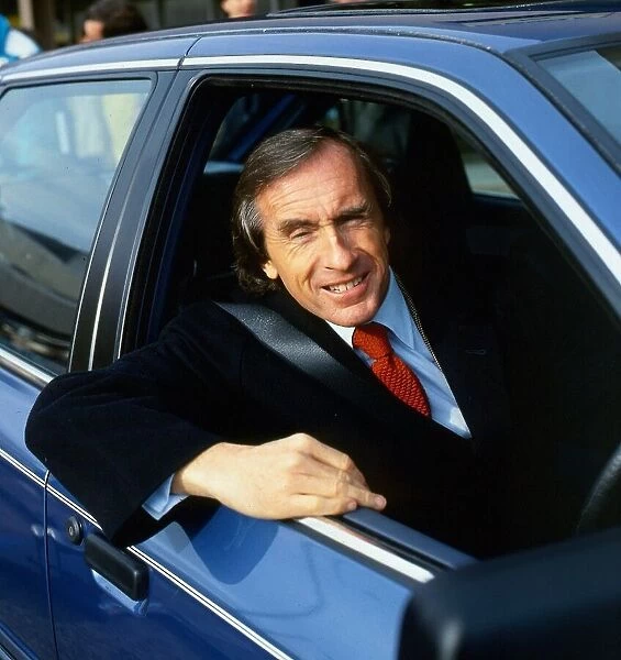 Jackie Stewart looking out of car window March 1988