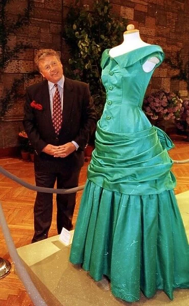 James whitaker examines Princess Dianas Dress June 1997 the dress is on display at a