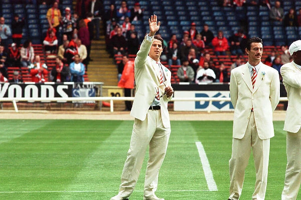 Jamie Redknapp (left) waves to the crowd as Ian Rush looks on during the pre-match