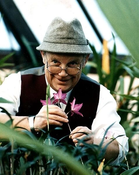 Jim McColl Beechgrove Garden television presenter with flowers tweed hat glasses at