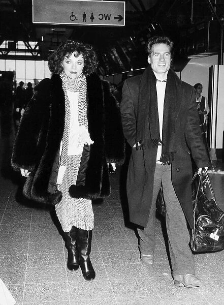 Joan Collins the actress with actor Neil Dickinson on their way to Los Angeles in