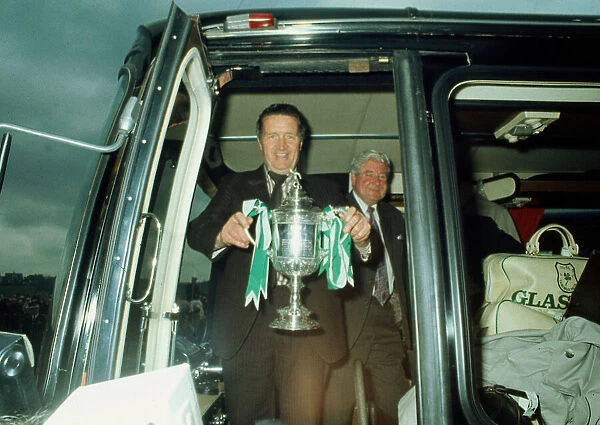 Jock Stein leaves bus with Scottish Cup trophy May 1974