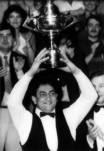 Joe Johnson holds aloft the trophy after winning the World Snooker Championships Final