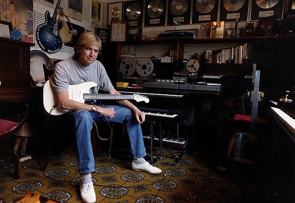 Justin Hayward lead singer of Moody Blues sits in his private recording studio at his