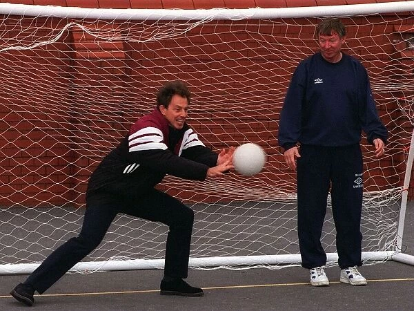 Labour leader Tony Blair keeps goal during a visit to a football training session at