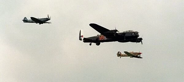 A Lancaster flanked by a Spitfire and a Hurricane over Cosford yesterday