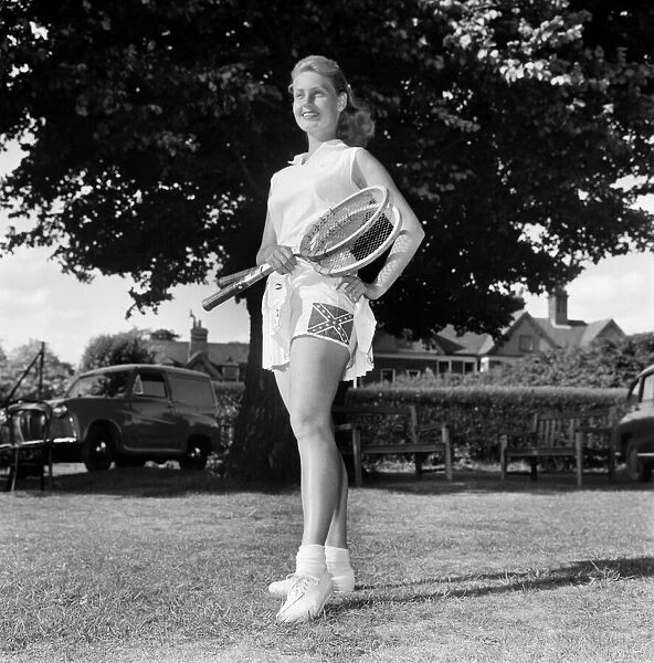 Lawn Tennis at Beckenham. Woman holding a tennis racket wearing a sports dress
