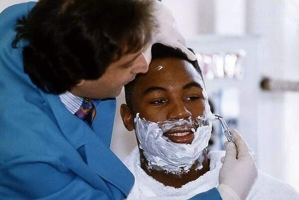 Lennox Lewis Boxing Heavyweight Boxer sitting down being shaved 28th February 1993