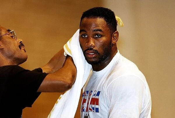 Lennox Lewis Boxing Heavyweight Boxer takes a break during a training session for his